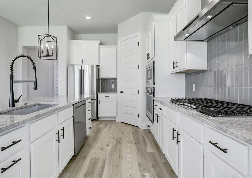 Designer kitchen with elevated finishes and fixtures.