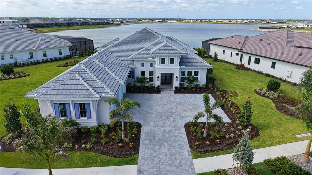 Front exterior of a new home in , Sarasota, FL, highlighting curb appeal (Image 1). Front exterior of a new home in , Sarasota, FL, highlighting curb appeal (Image 1).