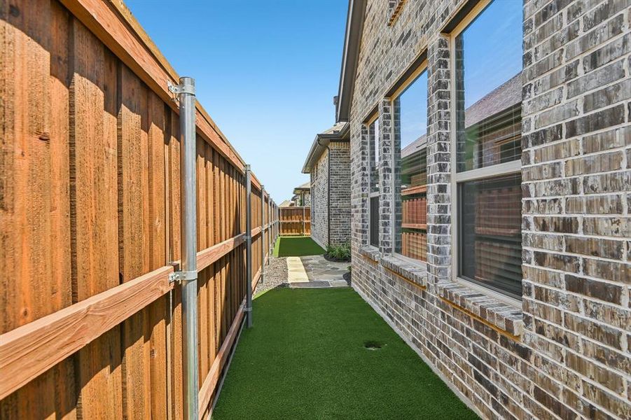 Exterior details and patio area of a home in Elements at Viridian - Garden Series, Arlington (Image 3). Exterior details and patio area of a home in Elements at Viridian - Garden Series, Arlington (Image 3).