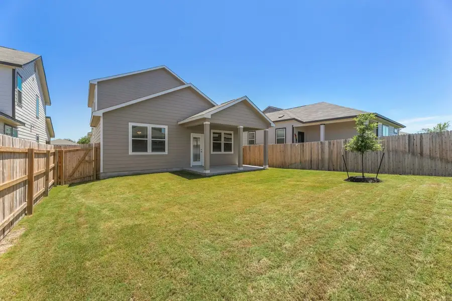 Exterior details and patio area of a home in Highland Ridge, New Braunfels (Image 3).
