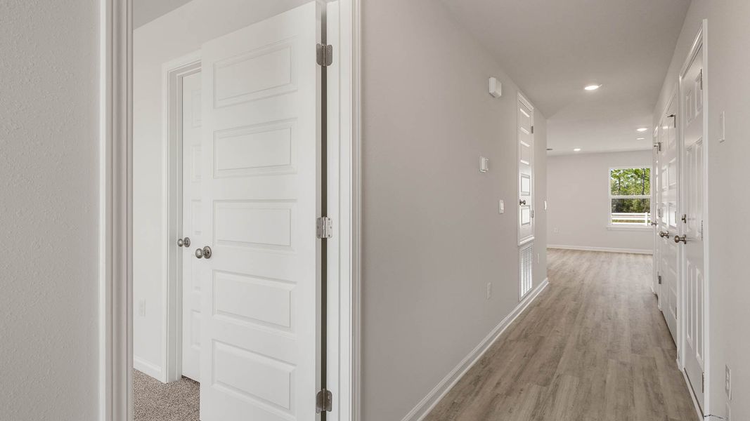 Spacious, unfurnished interior of a new home in Magnolia at the Bluffs Phase 3, Freeport (Image 9).