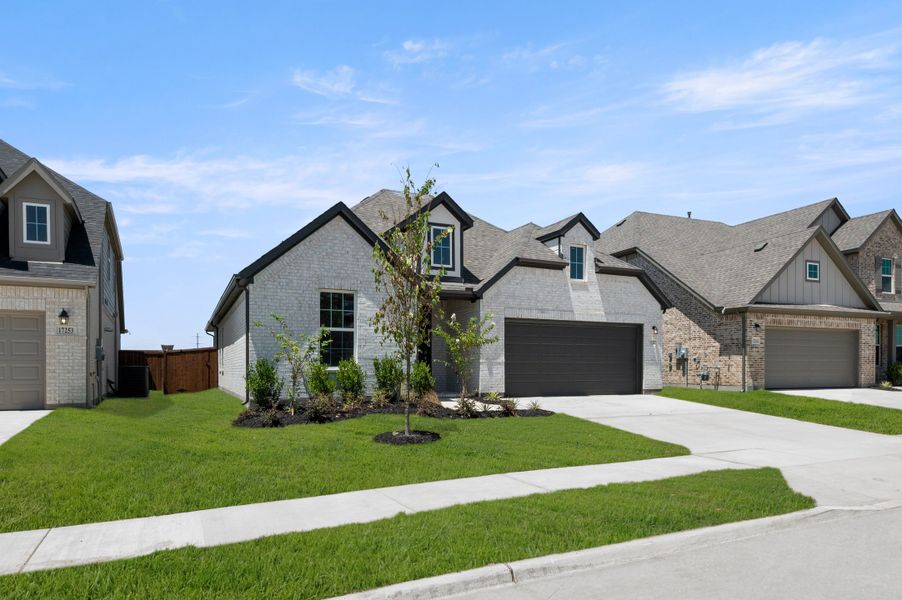 Representative exterior photo of a completed home built from the Valor by Rockwell Homes in Wildflower Ranch, Justin, TX (Image 25).