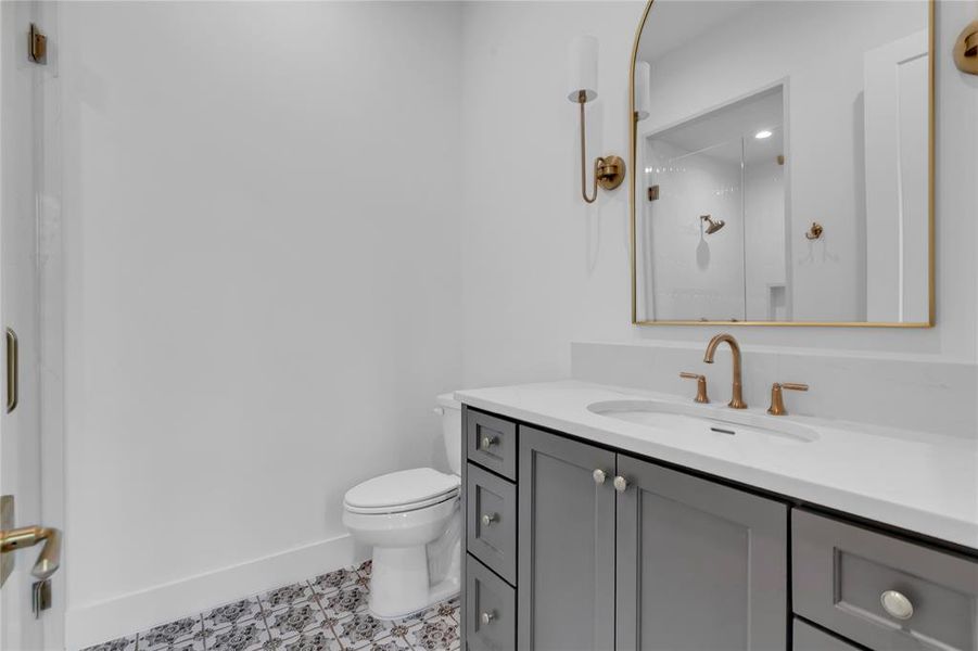Bathroom featuring vanity and a stall shower