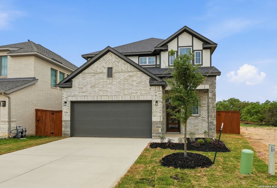 Front exterior of a new home in Stillwater Ranch, San Antonio, TX, highlighting curb appeal (Image 25).