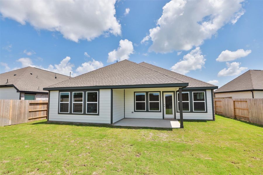 Front exterior of a new home in Oakwood Estates, Waller, TX, highlighting curb appeal (Image 20). Front exterior of a new home in Oakwood Estates, Waller, TX, highlighting curb appeal (Image 20).