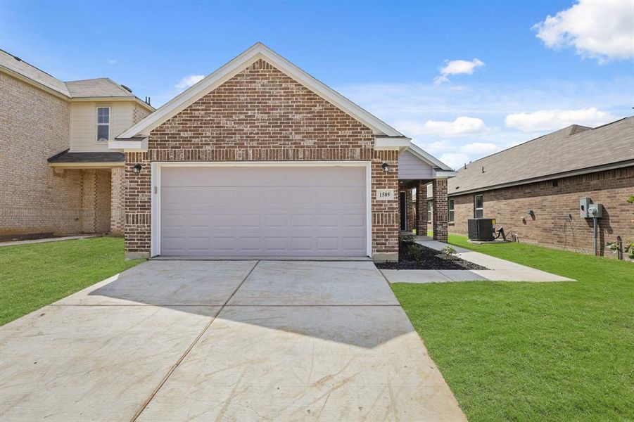 Front exterior of a new home in Christian Meadows, Ennis, TX, highlighting curb appeal (Image 2).