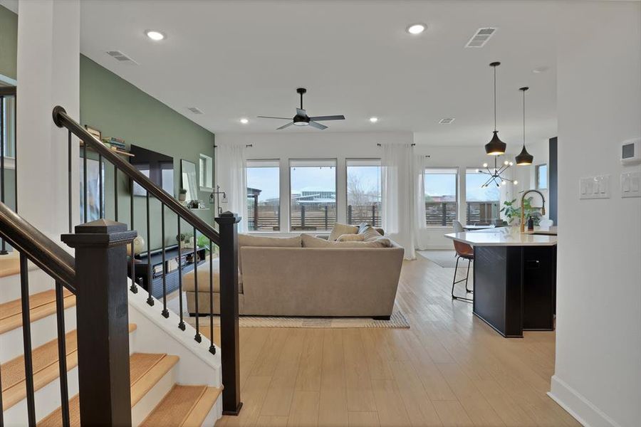 View of the living room and kitchen from hallway entrance