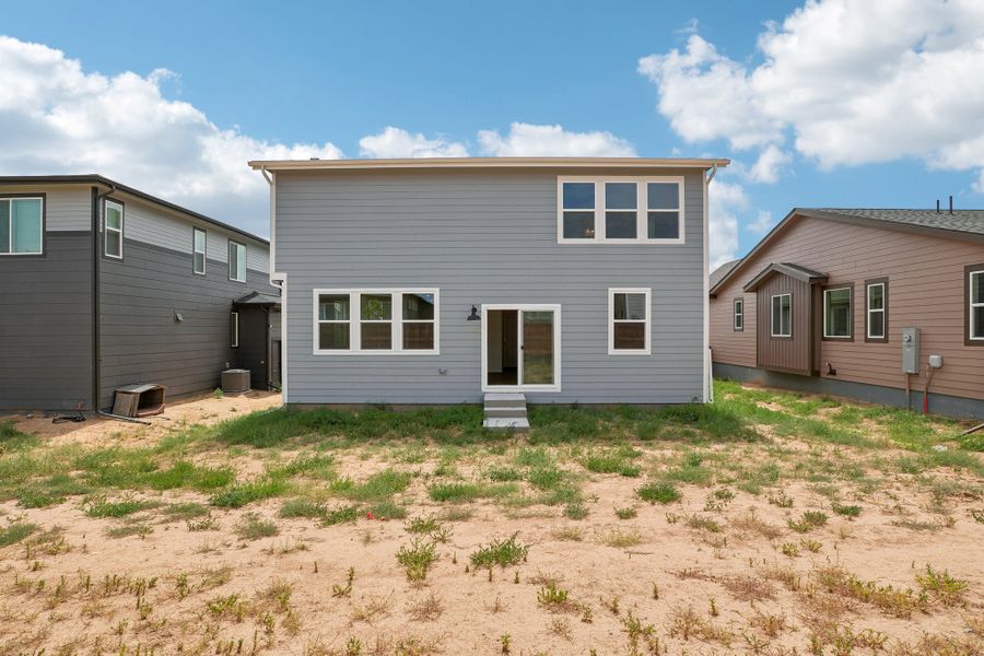 Exterior details and patio area of a home in The Cottages Collection at Ridgeline Vista, Brighton (Image 4).