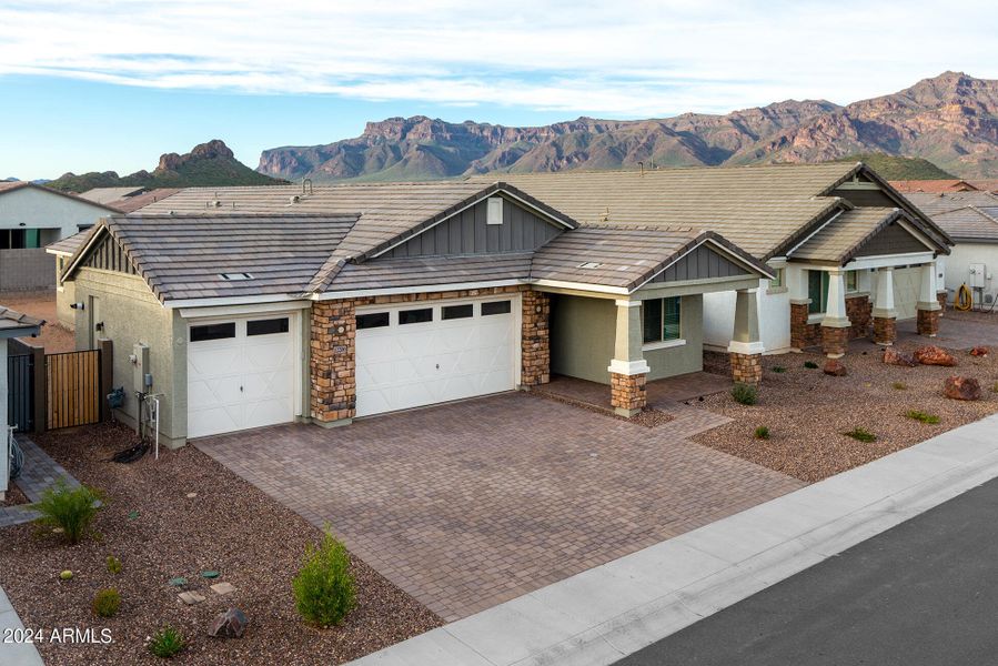 Three car garage with paver driveway