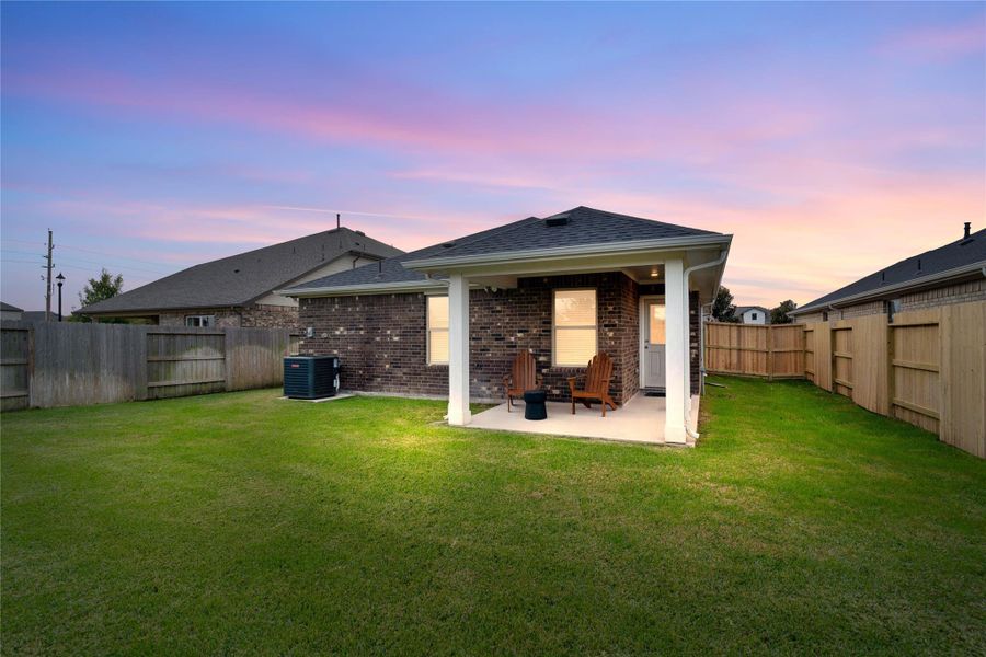 This property boasts a generously sized, fully sodded backyard and a cozy covered patio area, providing the perfect canvas for outdoor activities and comfortable seating.