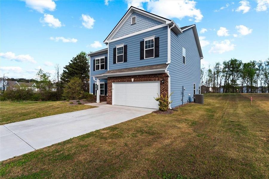 Front exterior of a new home in Garrett Preserve, Hiram, GA, highlighting curb appeal (Image 28).