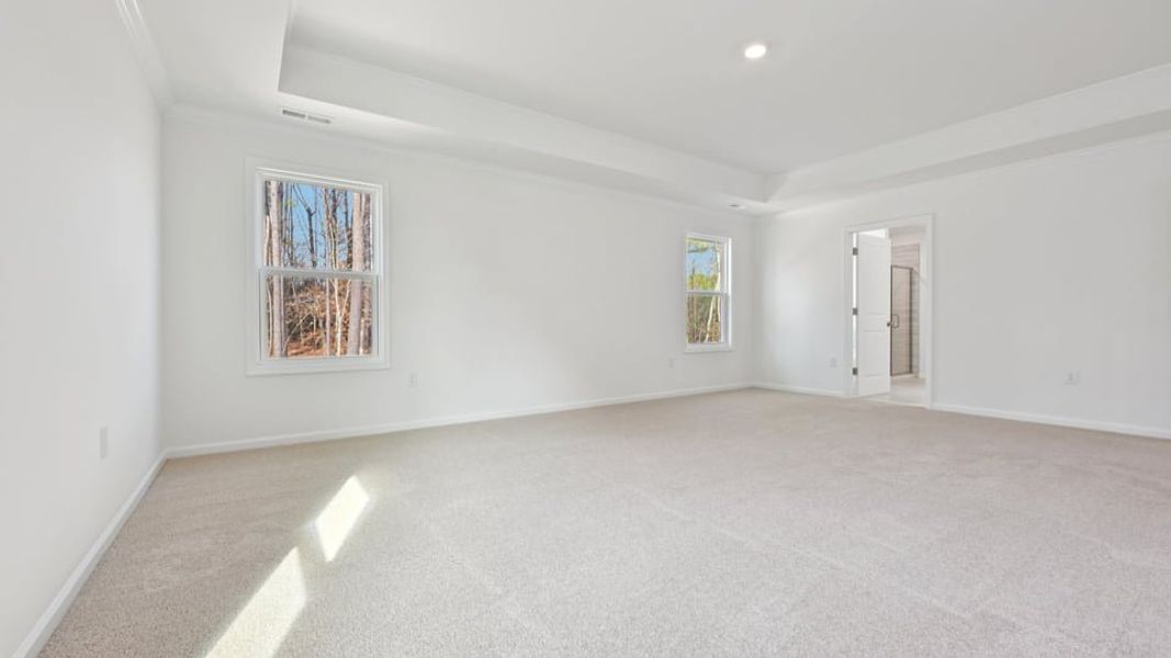 Representative unfurnished interior of a home built from the Wylie by D.R. Horton in Eagle Creek, Fuquay Varina (Image 32).