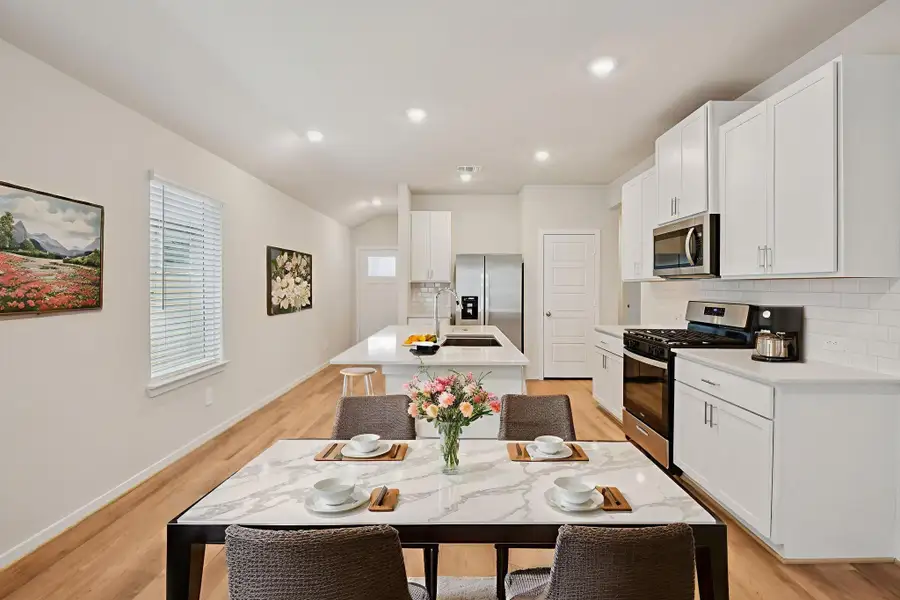Furnished interior view inside a new home in Granger Pointe - Traditional Series, Conroe (Image 9).
