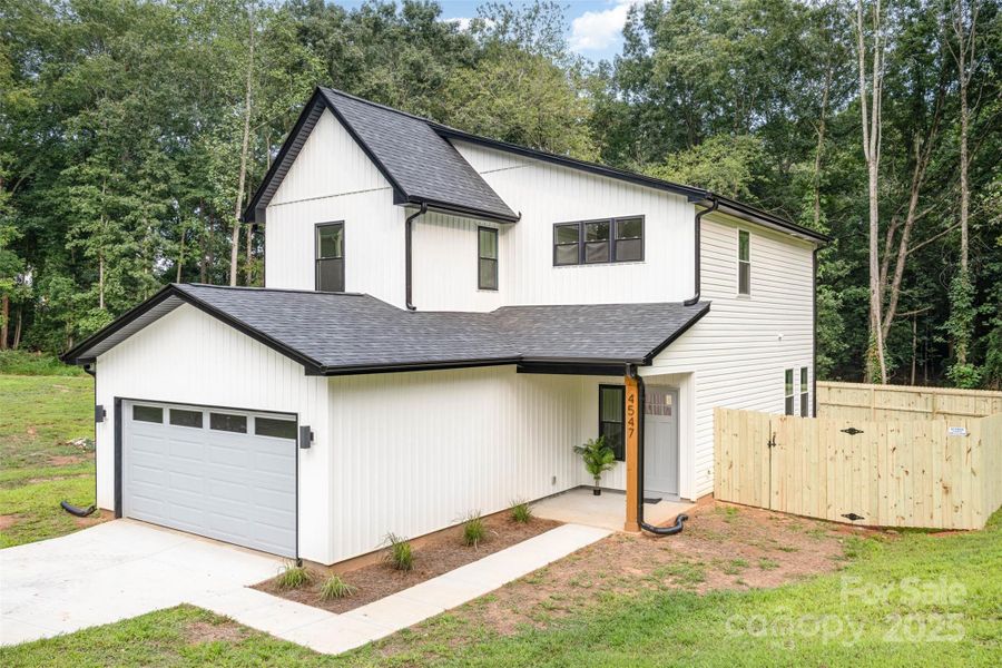 Front exterior of a new home in , Hickory, NC, highlighting curb appeal (Image 23).