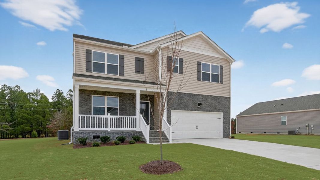 Front exterior of a new home in Mason Ridge, Spring Lake, NC, highlighting curb appeal (Image 2). Front exterior of a new home in Mason Ridge, Spring Lake, NC, highlighting curb appeal (Image 2).