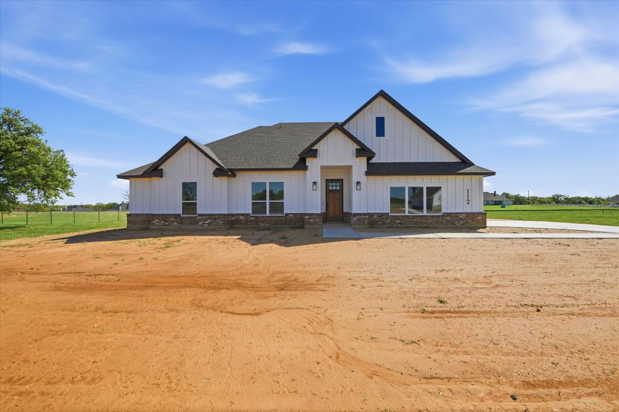 Front exterior of a new home in Zion Valley, Poolville, TX, highlighting curb appeal (Image 17). Front exterior of a new home in Zion Valley, Poolville, TX, highlighting curb appeal (Image 17).