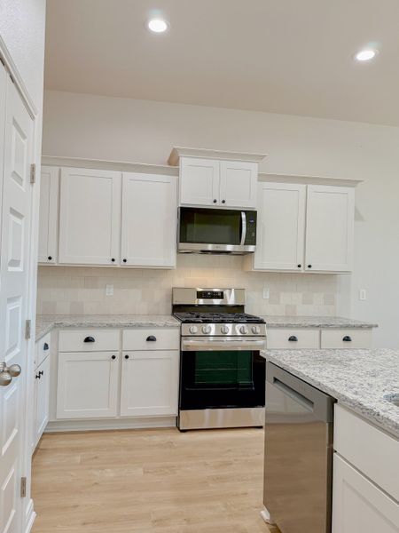 Furnished interior view inside a new home in TerraVista, Victoria (Image 12).