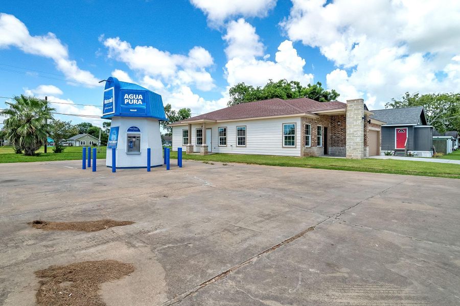 Front exterior of a new home in , Freeport, TX, highlighting curb appeal (Image 2).