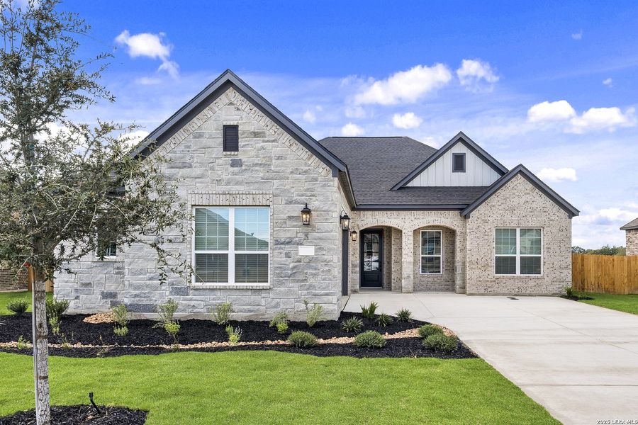 Front exterior of a new home in Potranco West, Castroville, TX, highlighting curb appeal (Image 2). Front exterior of a new home in Potranco West, Castroville, TX, highlighting curb appeal (Image 2).