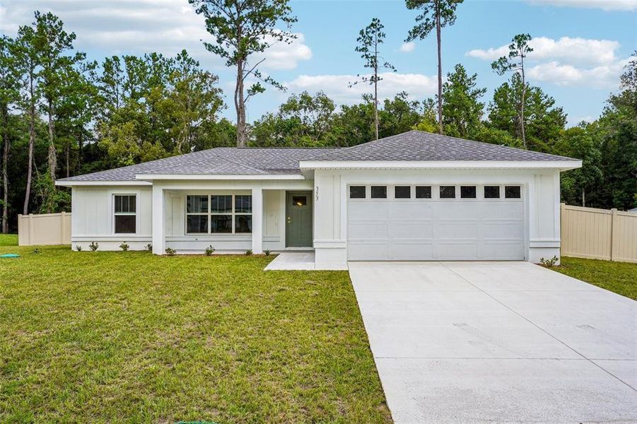 Front exterior of a new home in , Citrus Springs, FL, highlighting curb appeal (Image 25). Front exterior of a new home in , Citrus Springs, FL, highlighting curb appeal (Image 25).