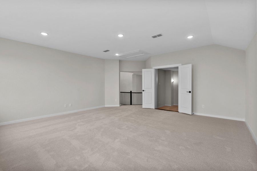 The elevated gameroom which leads to the media room.