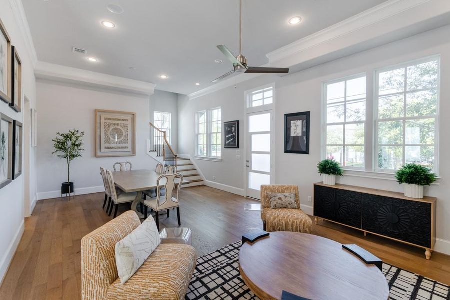 Natural light cascades into this spacious first floor living and dining area. Natural light cascades into this spacious first floor living and dining area.