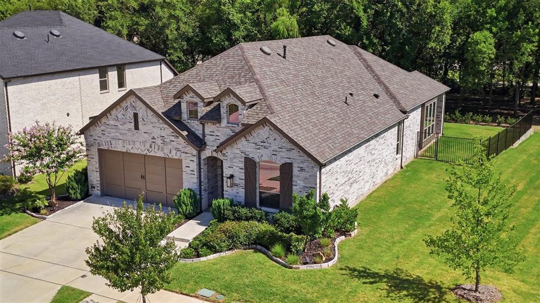 Front exterior of a new home in , Van Alstyne, TX, highlighting curb appeal (Image 23). Front exterior of a new home in , Van Alstyne, TX, highlighting curb appeal (Image 23).