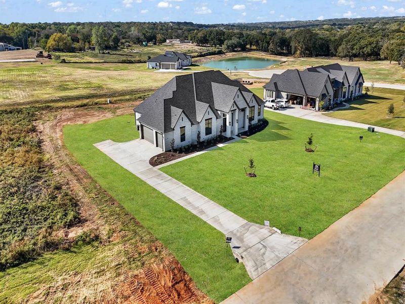 Aerial view of property and surrounding area with a large body of water Aerial view of property and surrounding area with a large body of water