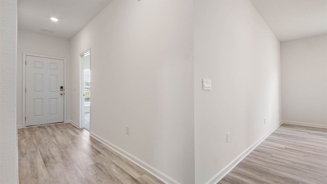 Representative unfurnished interior of a home built from the Aspen by D.R. Horton in Owl's Head East, Freeport (Image 19).