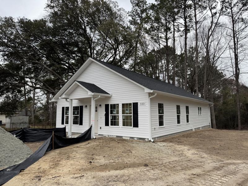 Front exterior of a new home in , Eutawville, SC, highlighting curb appeal (Image 1). Front exterior of a new home in , Eutawville, SC, highlighting curb appeal (Image 1).