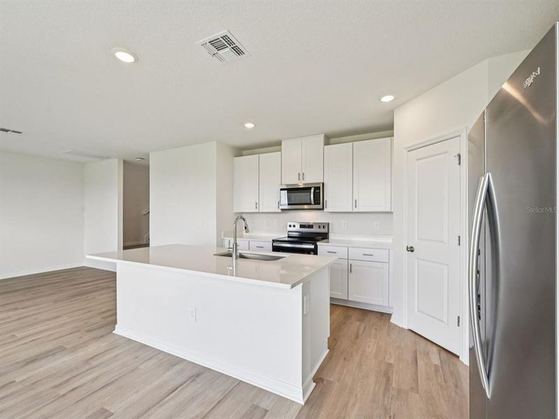 Furnished interior view inside a new home in Oakfield Trails - Signature Series, Parrish (Image 8).