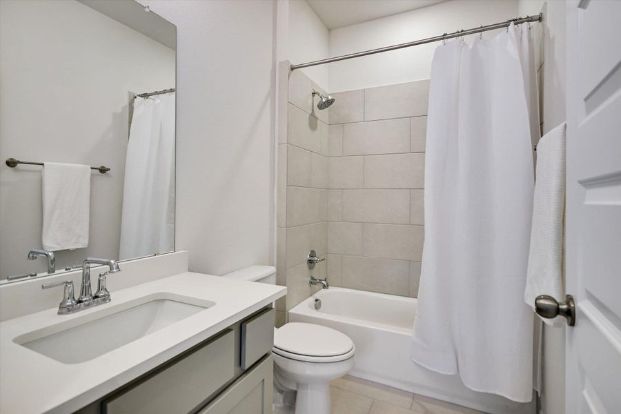 Second of two upstairs full bathrooms