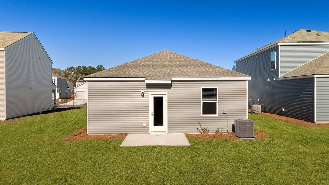 Exterior details and patio area of a home in Pine Hills at Cane Bay, Summerville (Image 3). Exterior details and patio area of a home in Pine Hills at Cane Bay, Summerville (Image 3).