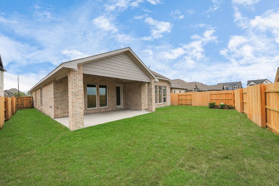 Front exterior of a new home in 50' Traditional Homes at Elyson, Katy, TX, highlighting curb appeal (Image 20). Front exterior of a new home in 50' Traditional Homes at Elyson, Katy, TX, highlighting curb appeal (Image 20).