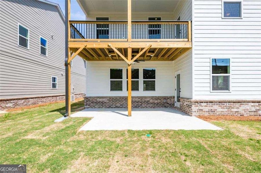 Exterior details and patio area of a home in The Paddocks at Doc Hughes, Buford (Image 2).