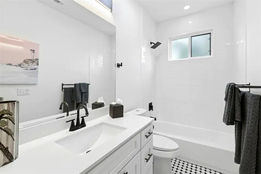 Bathroom with vanity, shower / tub combination, recessed lighting, and tile patterned flooring Bathroom with vanity, shower / tub combination, recessed lighting, and tile patterned flooring