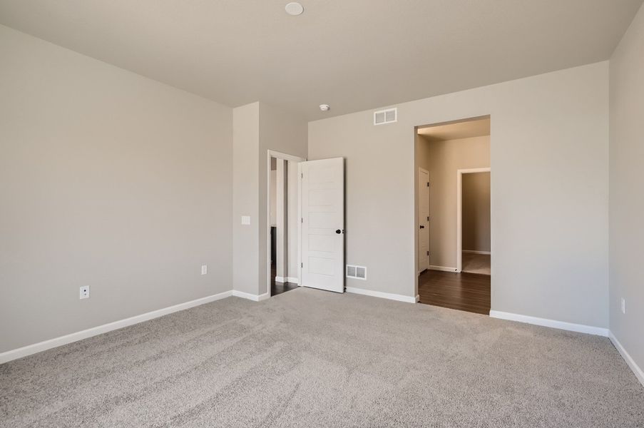 Main floor primary bedroom of the ranch style Telluride plan by Century Communities