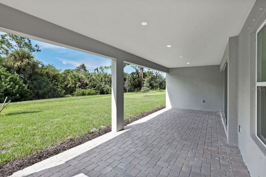 Exterior details and patio area of a home in The Cove at West Port, Port Charlotte (Image 26). Exterior details and patio area of a home in The Cove at West Port, Port Charlotte (Image 26).