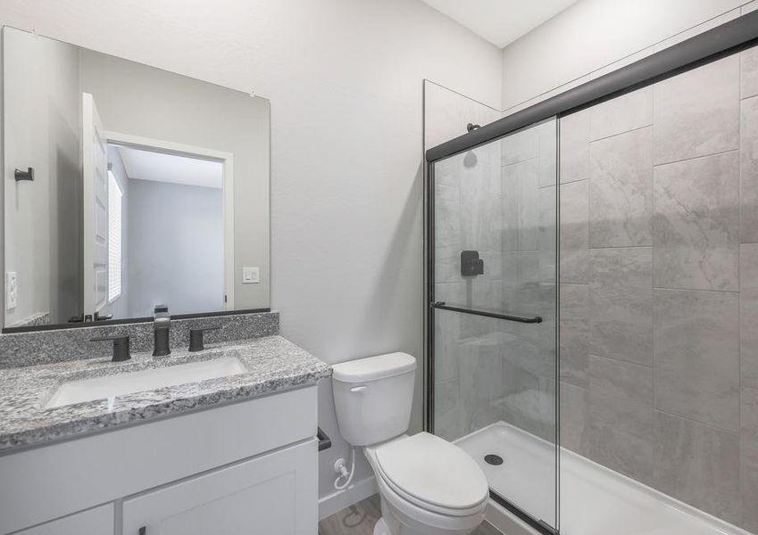 Master bathroom with a single-sink vanity and walk-in shower.