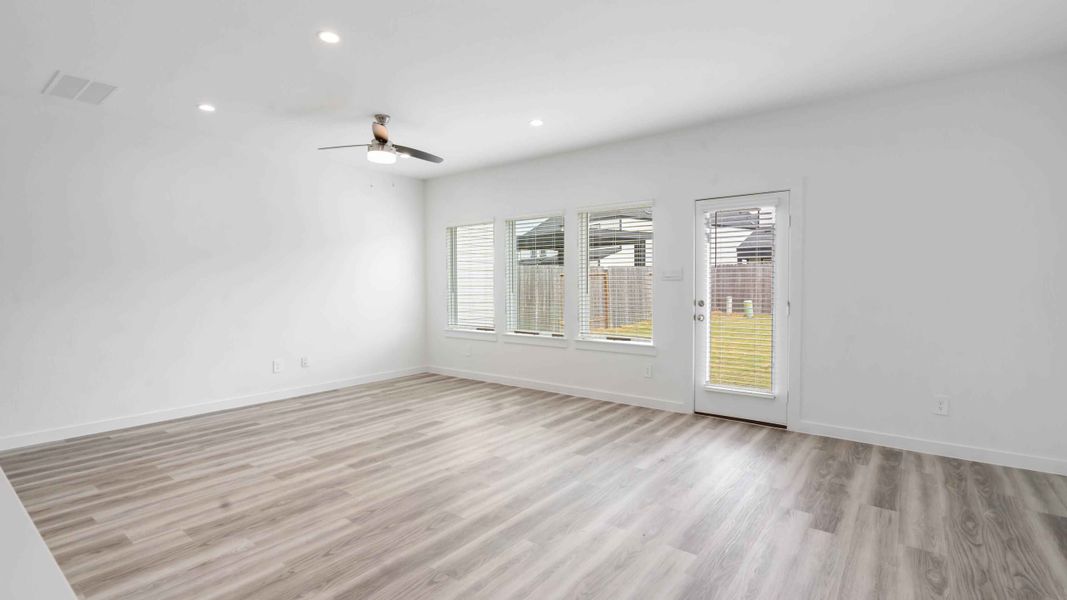 Representative unfurnished interior of a home built from the Jasmine by D.R. Horton in City Gate North, Houston (Image 7).