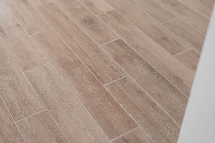 Wood-look tile flooring throughout the main living areas, including bathrooms