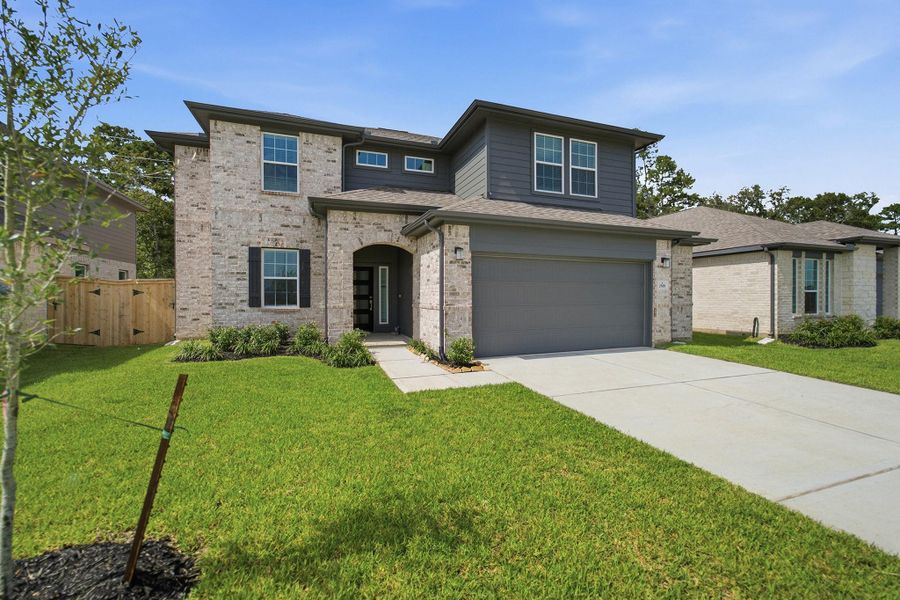 Front exterior of a new home in Sundance Cove, Crosby, TX, highlighting curb appeal (Image 15). Front exterior of a new home in Sundance Cove, Crosby, TX, highlighting curb appeal (Image 15).
