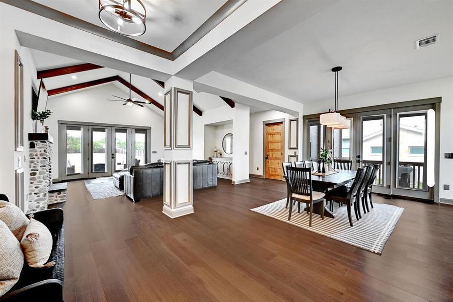 Dining space with dark wood finished floors and french doors