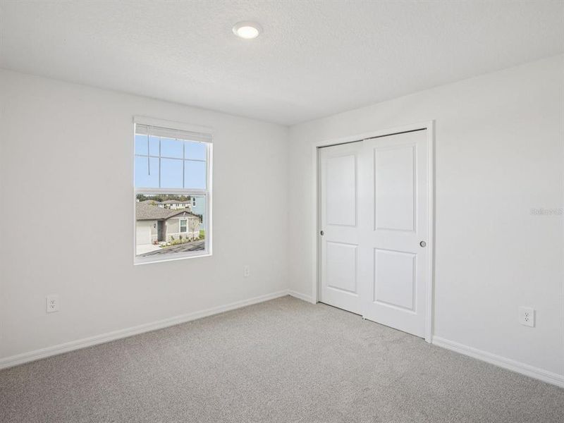 Spacious, unfurnished interior of a new home in The Grove at Stuart Crossing - Classic Series, Bartow (Image 34).