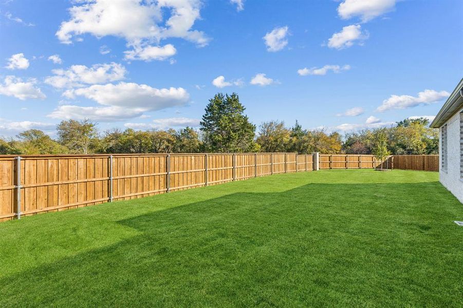 Covered Patio in the Wimbledon home plan by Trophy Signature Homes – REPRESENTATIVE PHOTO