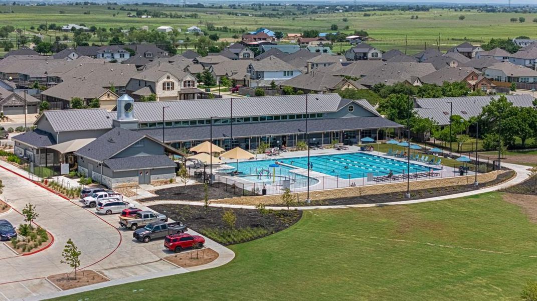Aerial view of residential area with a pool area Aerial view of residential area with a pool area