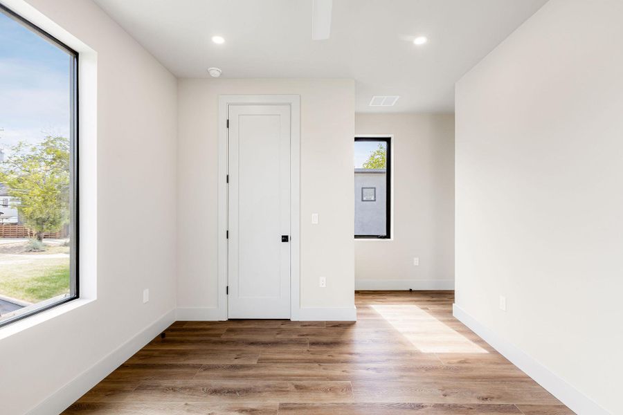 Empty room featuring light wood-style floors and recessed lighting Empty room featuring light wood-style floors and recessed lighting