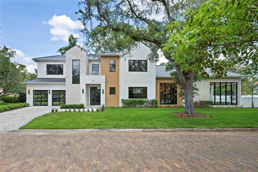 Front exterior of a new home in , Winter Park, FL, highlighting curb appeal (Image 24).