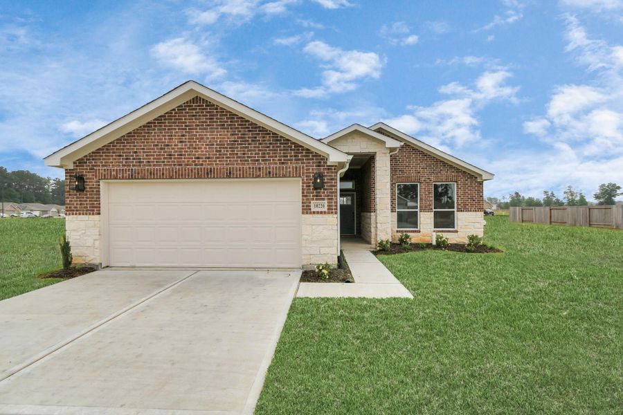 Front exterior of a new home in Grand Oaks Reserve, Cleveland, TX, highlighting curb appeal (Image 27). Front exterior of a new home in Grand Oaks Reserve, Cleveland, TX, highlighting curb appeal (Image 27).