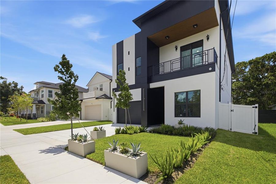 Front exterior of a new home in , Tampa, FL, highlighting curb appeal (Image 26). Front exterior of a new home in , Tampa, FL, highlighting curb appeal (Image 26).